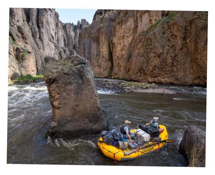 Landing Page A polaroid of two adventurers rafting through the rugged whitewater of the Bruneau River.