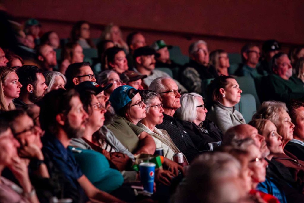 Landing Page A captivated audience seated at the Egyptian Theatre watching The 3100™ premiere.